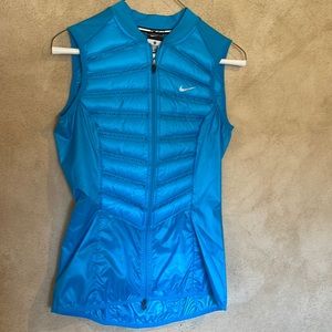X-small lightly insulated Nike running vest with pocket in the back.  Never worn